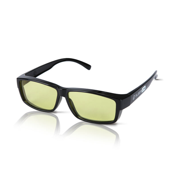 Black DaytimeMAX fit‑over blue light blocking glasses worn over prescription frames